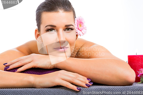 Image of Beautiful woman enjoying a hot stone massage