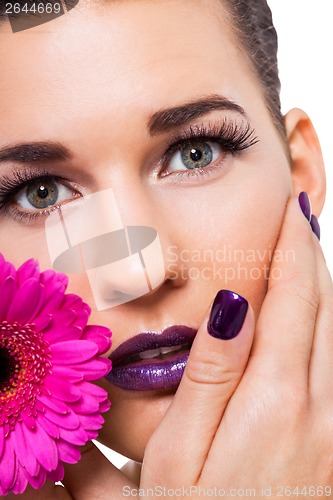 Image of Beautiful woman in purple make-up