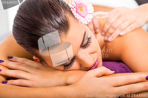 Image of Beautiful woman having a back massage