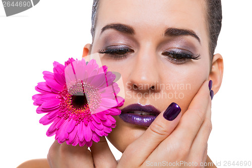 Image of Beautiful woman in purple make-up