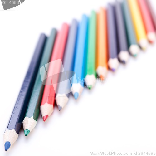 Image of Bunch of colourful pencil crayons on white