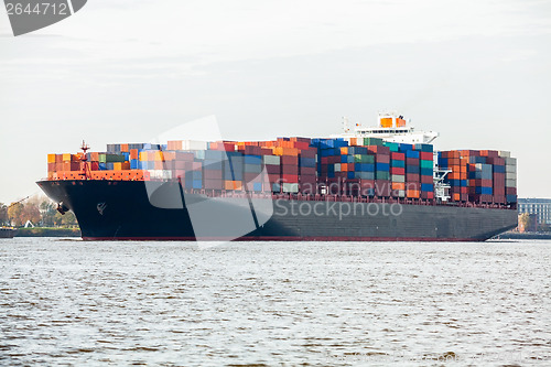 Image of Fully laden container ship in port