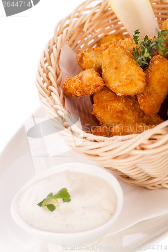 Image of Crumbed chicken nuggets in a basket