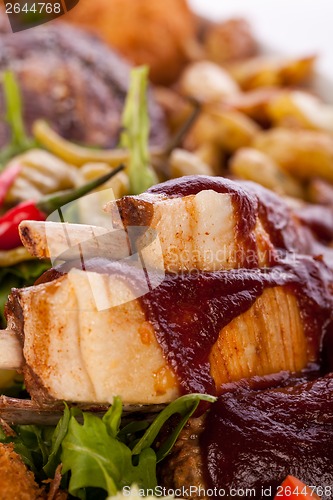 Image of Platter of mixed meats, salad and French fries