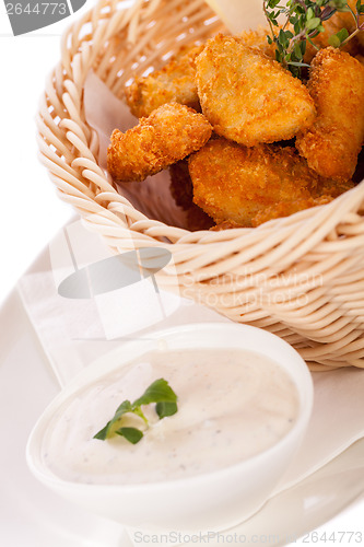 Image of Crumbed chicken nuggets in a basket