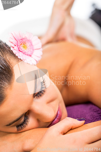 Image of Beautiful woman having a back massage