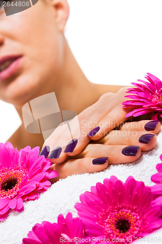 Image of Woman with beautiful manicured purple nails