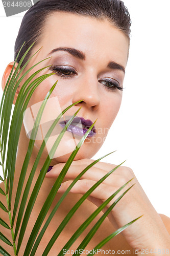 Image of Beautiful woman in purple make-up