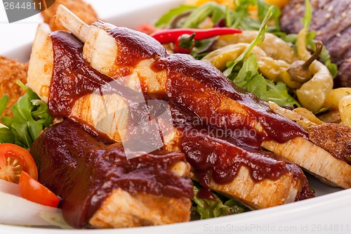 Image of Platter of mixed meats, salad and French fries