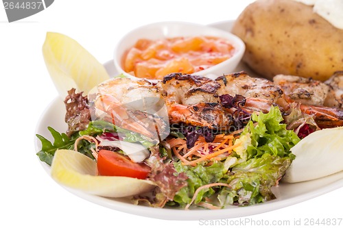 Image of Grilled prawns with endive salad and jacket potato