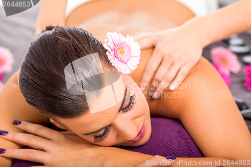 Image of Beautiful woman having a back massage