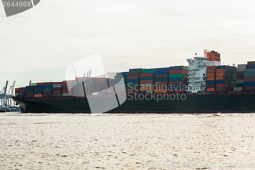 Image of Fully laden container ship in port