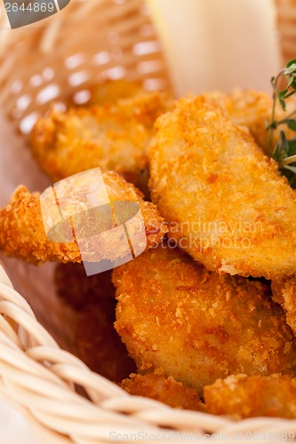 Image of Crumbed chicken nuggets in a basket