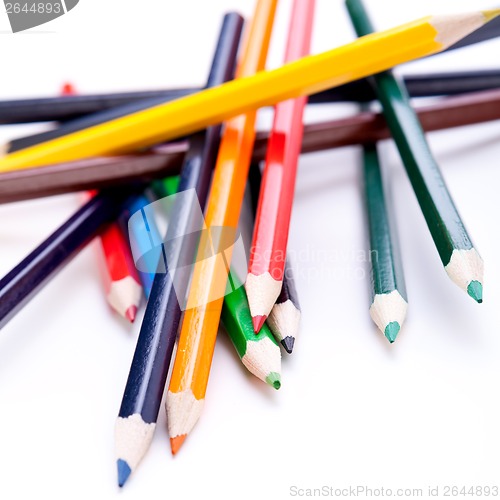 Image of Bunch of colourful pencil crayons on white