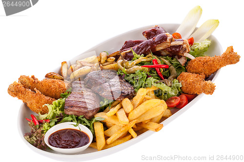 Image of Platter of mixed meats, salad and French fries