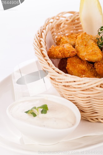 Image of Crumbed chicken nuggets in a basket