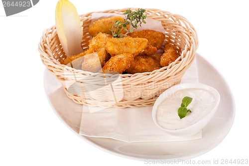 Image of Crumbed chicken nuggets in a basket