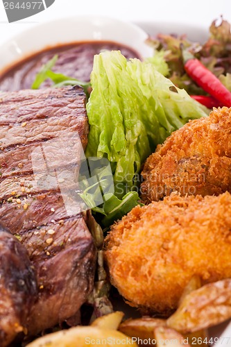 Image of Platter of mixed meats, salad and French fries