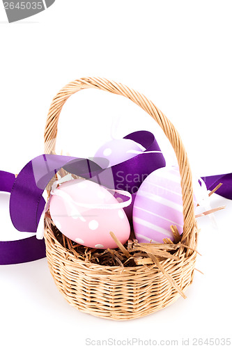 Image of Straw basket with traditional Easter eggs