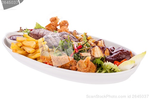 Image of Platter of mixed meats, salad and French fries