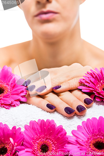 Image of Woman with beautiful manicured purple nails