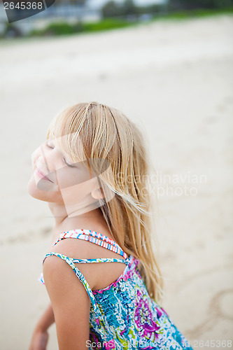 Image of Happy cute young girl at beach