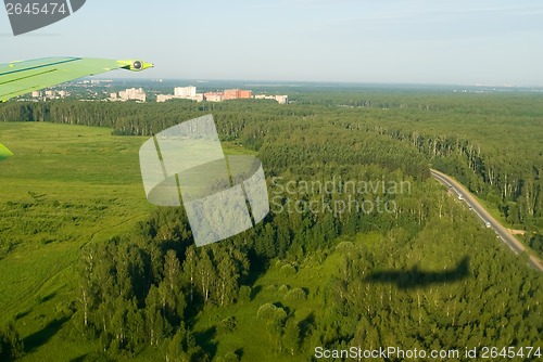 Image of Shadow of plane on forest background