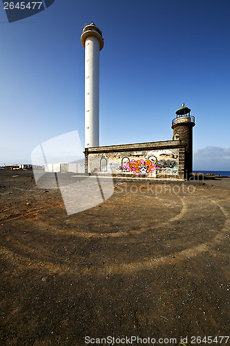 Image of lighthouse and rock in the blue sky teguise 