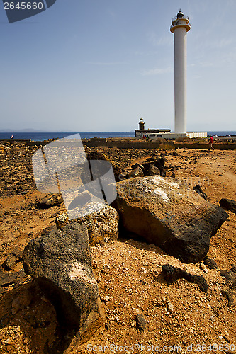 Image of lighthouse and rock in the blue sky   anzarote spain