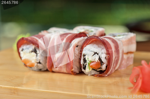 Image of Sushi roll with bacon