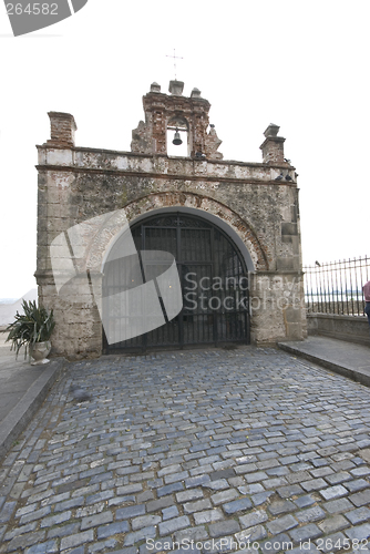 Image of capilla el cristo on cobble stone road