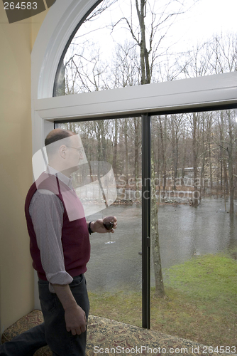Image of looking at flooded backyard