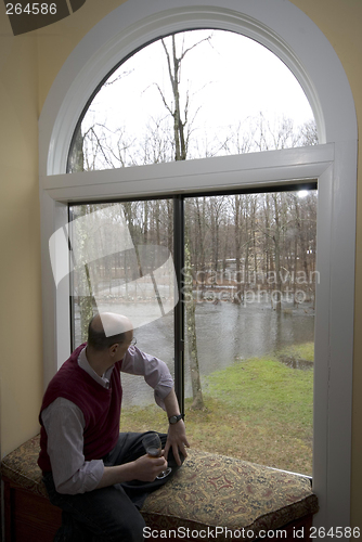 Image of looking at flooded backyard