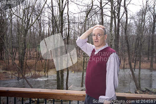 Image of looking at flooded backyard