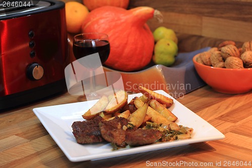 Image of steak with potatoes and wine