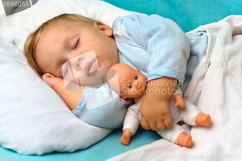 Image of boy sleeping in a bed