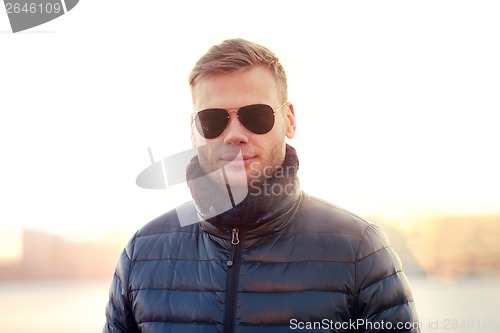 Image of Portrait of young man in sunglasses