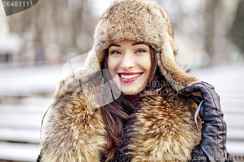 Image of Girl smiling in fur hat and coat