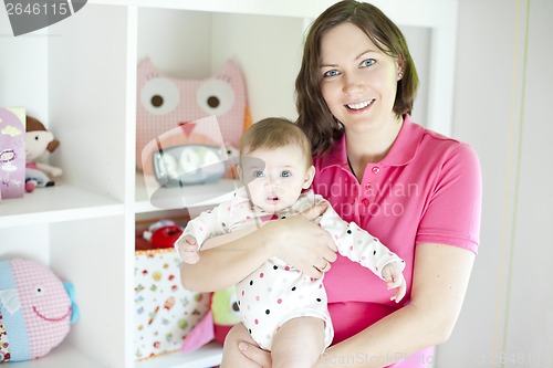 Image of Mother and baby in playroom