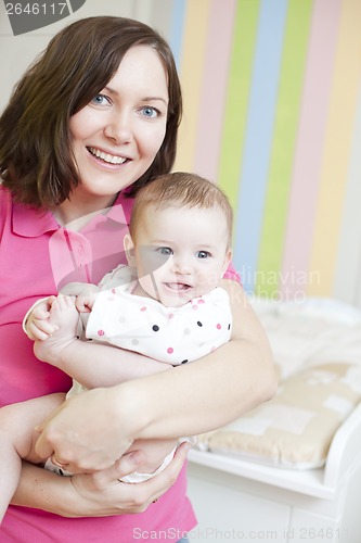 Image of Happy mother and child in nursery