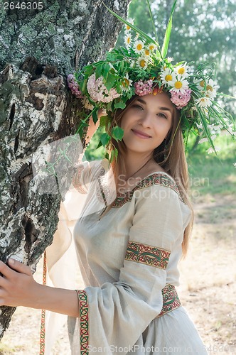 Image of Beautiful woman with flower wreath