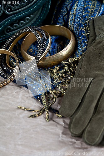 Image of vintage bag, leather gloves, bracelets and scarf