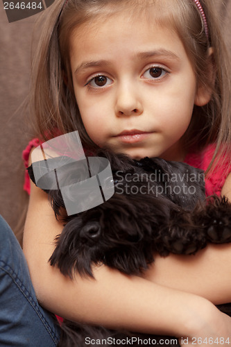 Image of Portrait of a little girl with dog