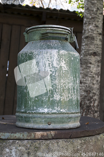 Image of Old metal milk can