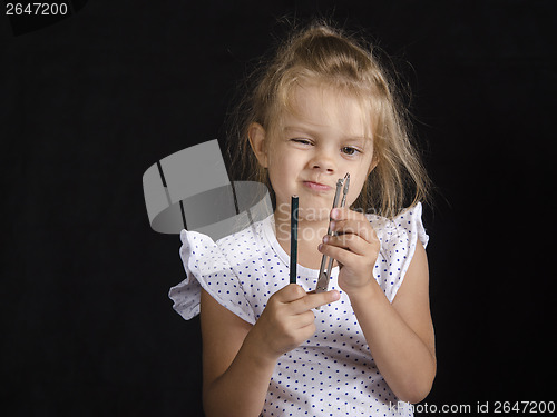 Image of Disheveled girl looks at compass