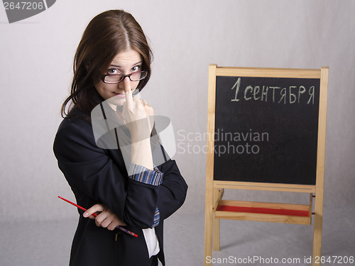 Image of Portrait of teacher spectacles on his nose and Board