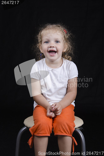 Image of Portrait of smiling-old girl on a black background