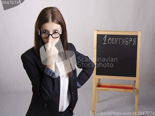 Image of Portrait of teacher spectacles on his nose and Board