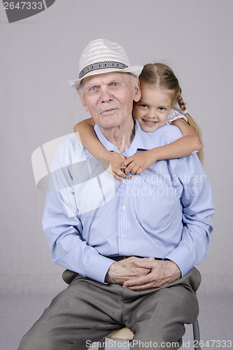 Image of Portrait of an old man eighty years with granddaughter