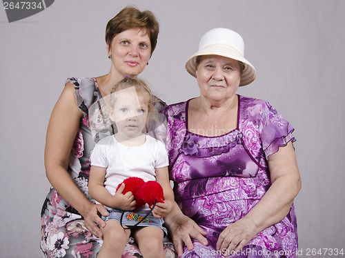 Image of Family portrait of child, grandmother and great-grandmother